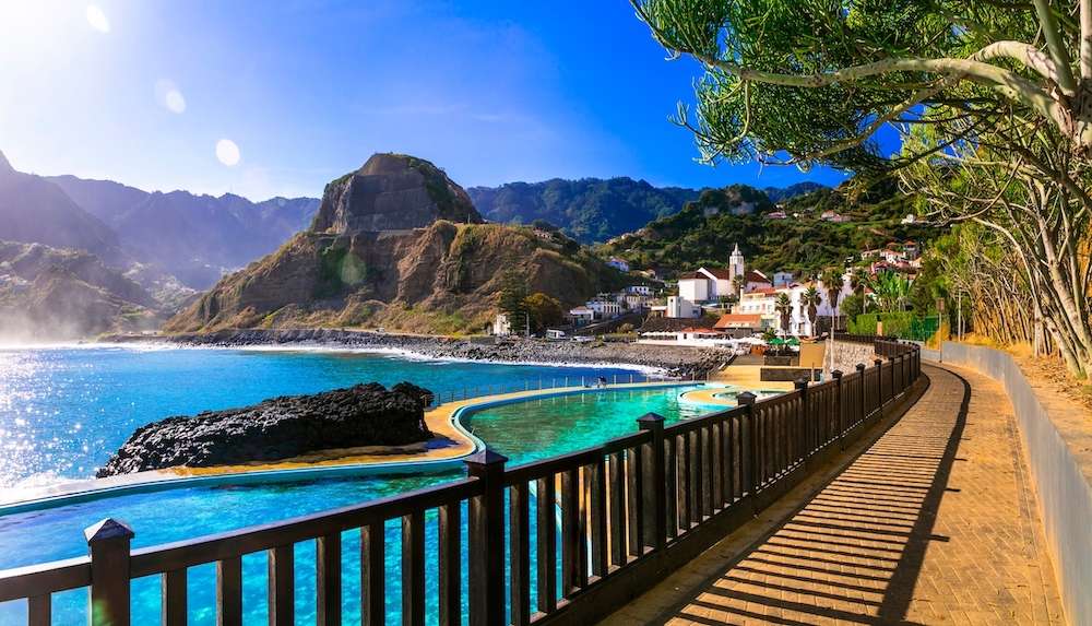 Scenic Madeira island, natural swimming pools of charming Porto da Cruz village. Popular tourist resort in Portugal