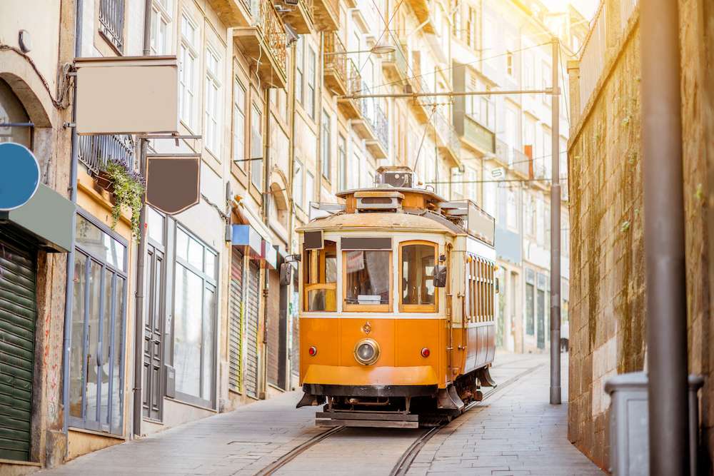 Street view with famous retro tourist tram in the old town of Porto city, Portugal on tour with Exodus Travels