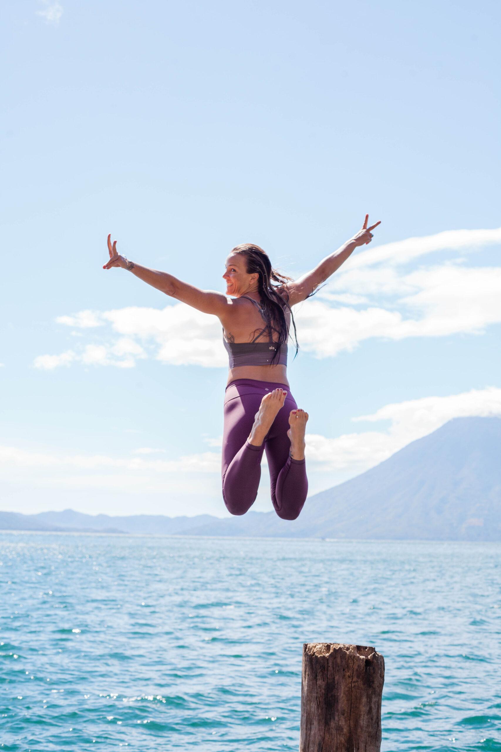 flow yoga jumping in lake