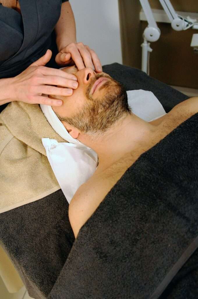 man at spa getting a facial