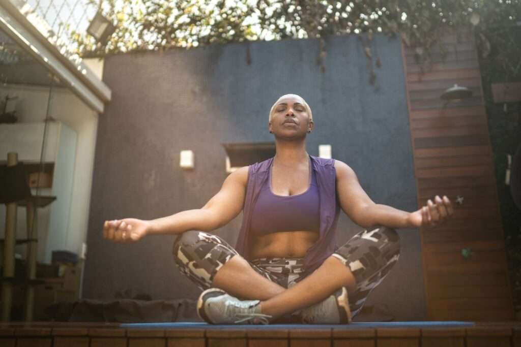 woman meditating outdoors