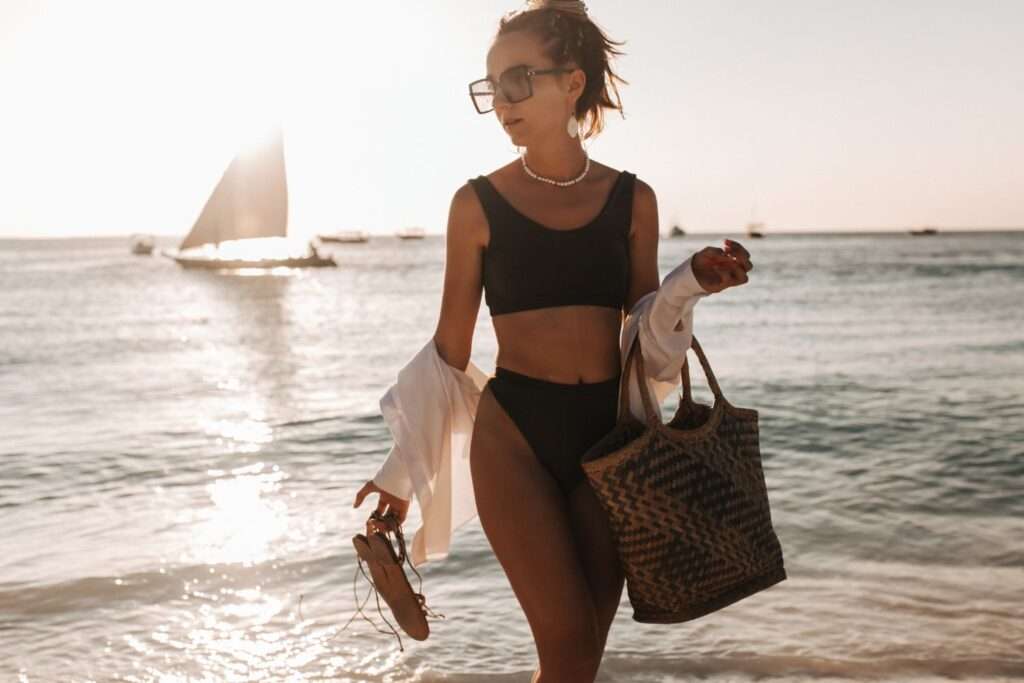 woman at beach with bag